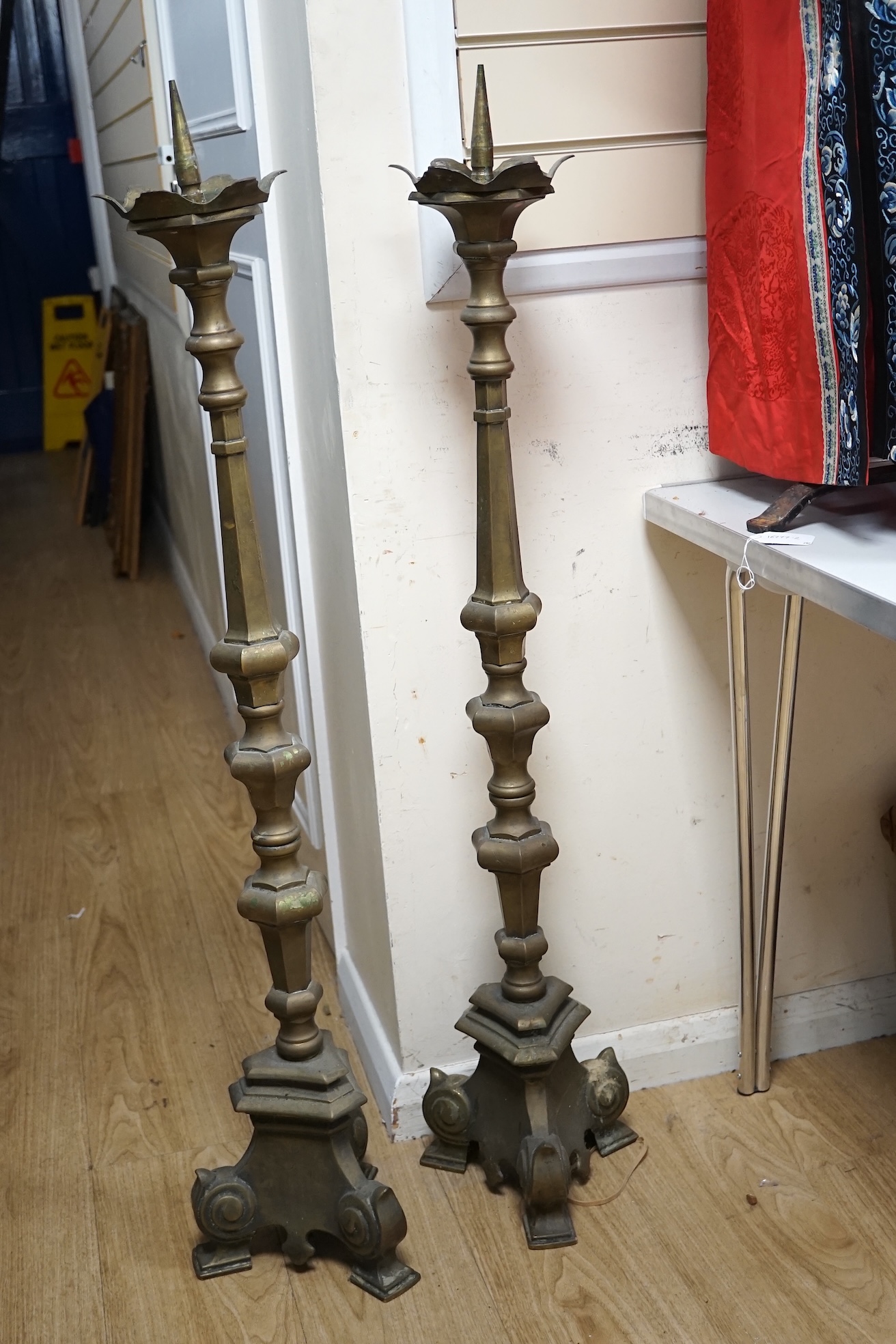 A pair of large Dutch altar brass candle sticks, 113cm high. Condition - fair to good